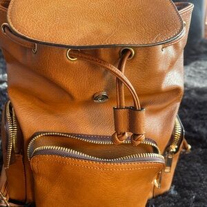 ALDO tan  Backpack excellent condition only one tiny call out as pictured.